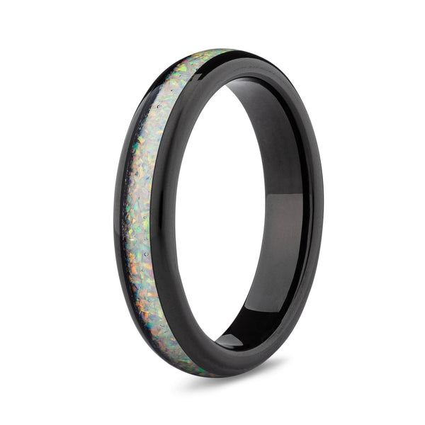 Black ring with opal inlay on a white background