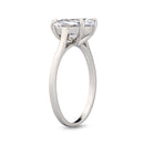 Standing silver ring with an oval diamond on a white background