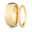 Two gold rings on a white background