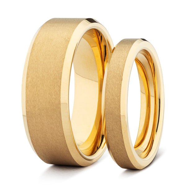 Two gold his and hers wedding bands on a white background