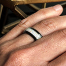 A hand wearing the Beast 2.0 men’s white opal ring
