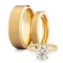 Matte gold wedding rings and diamond engagement ring