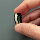 Video of a man putting on the Beast 2.0 men’s white opal ring