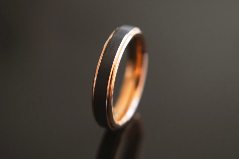 tungsten rose gold ring standing upright