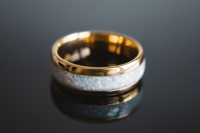 a white opal wedding ring with a gold band