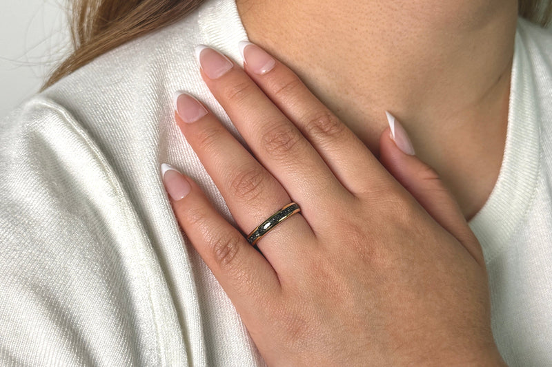 Woman wearing The Juliet Gold and meteorite wedding band
