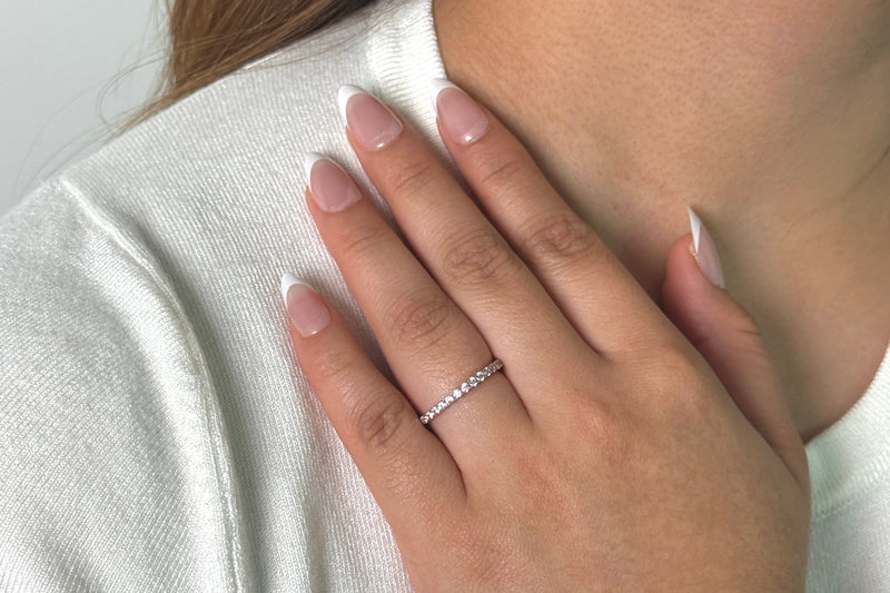 Woman’s hand wearing The Emma Rose gold cubic zirconia ring