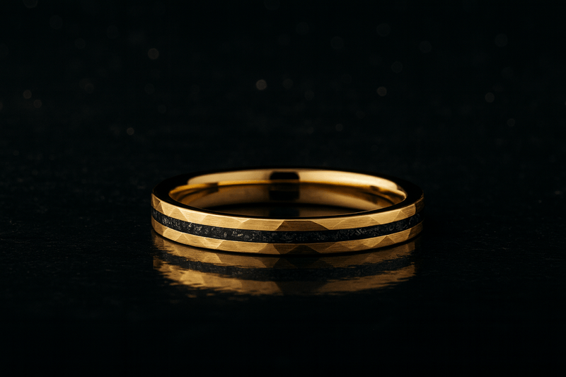 woman’s hammered gold and meteorite wedding band against a dark background